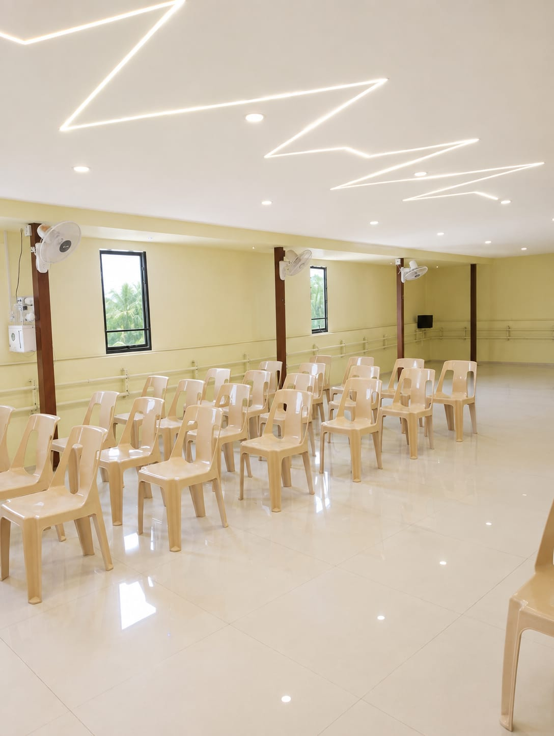 Event hall arranged with seating and designer LED ceiling lighting